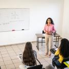 Teacher and students in classroom.