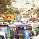 Buses, cars, and motorcyles congest a busy street in Jaipur, India