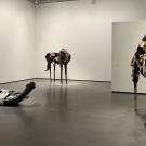 three horse scultpures in a gallery