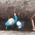 Two people in a trench seen from above 