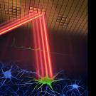 Red laser beams bounce off a mirrored ceiling onto a green cell.