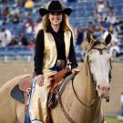 McKensey Middleton dressed in “Maggie the Aggie” costume while riding her horse, Sugar