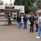 People stand in line at the California Hall Peet's Coffee.