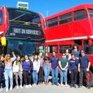 Unitrans drivers pose in front of double-deckers old and new