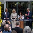 Four people cut ceremonial ribbon.