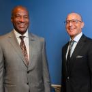 Gary S. May and David Lubarsky, both in suit and tie, pose side by side, smiling.