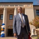 Chancellor Gary S. Map, UC Davis, in suit, in front of C.K. McClatchy High School