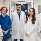 Group photo of five people in lab.