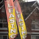 Leasing flags in front of an apartment complex