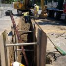 Workers digging large trench