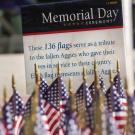 Small flags on the Quad, with Memorial Day Ceremony sign, 2021