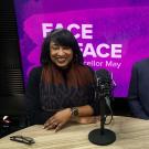 Renetta Garrison Tull and Gary S. May sit side-by-side in a video studio, in front of a purple background with the text "Face to Face With Chancellor May"