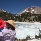 Woman and baby looking at mountain vista