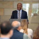 Chancellor Gary S. May speaks at lectern