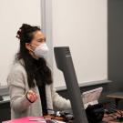 Lea Nglankong, a UC Davis undergraduate teaching assistant, stands in front of a chemistry support class and goes over a practice exam during winter quarter 2022.