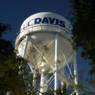 UC Davis water tower with tree greenery foreground