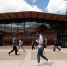 Students walk past Walker Hall