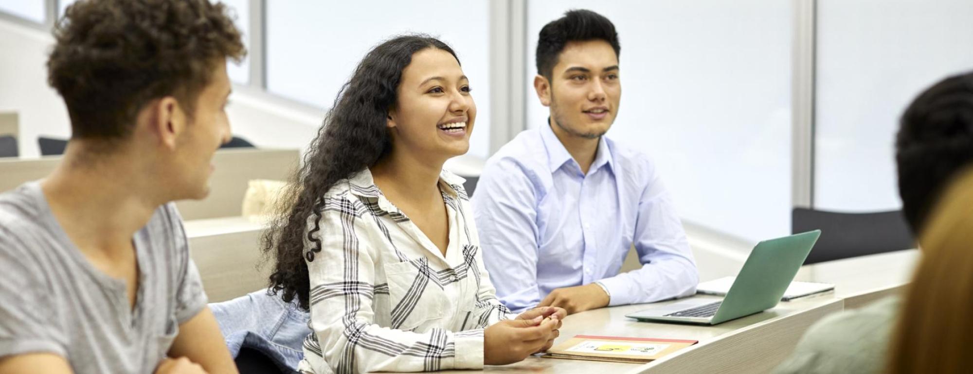 students listening to a presentation in a classroom