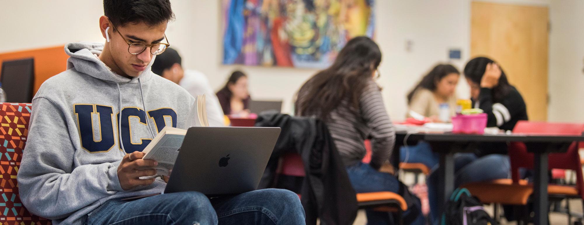 A male student studies at the Cross Cultural Center