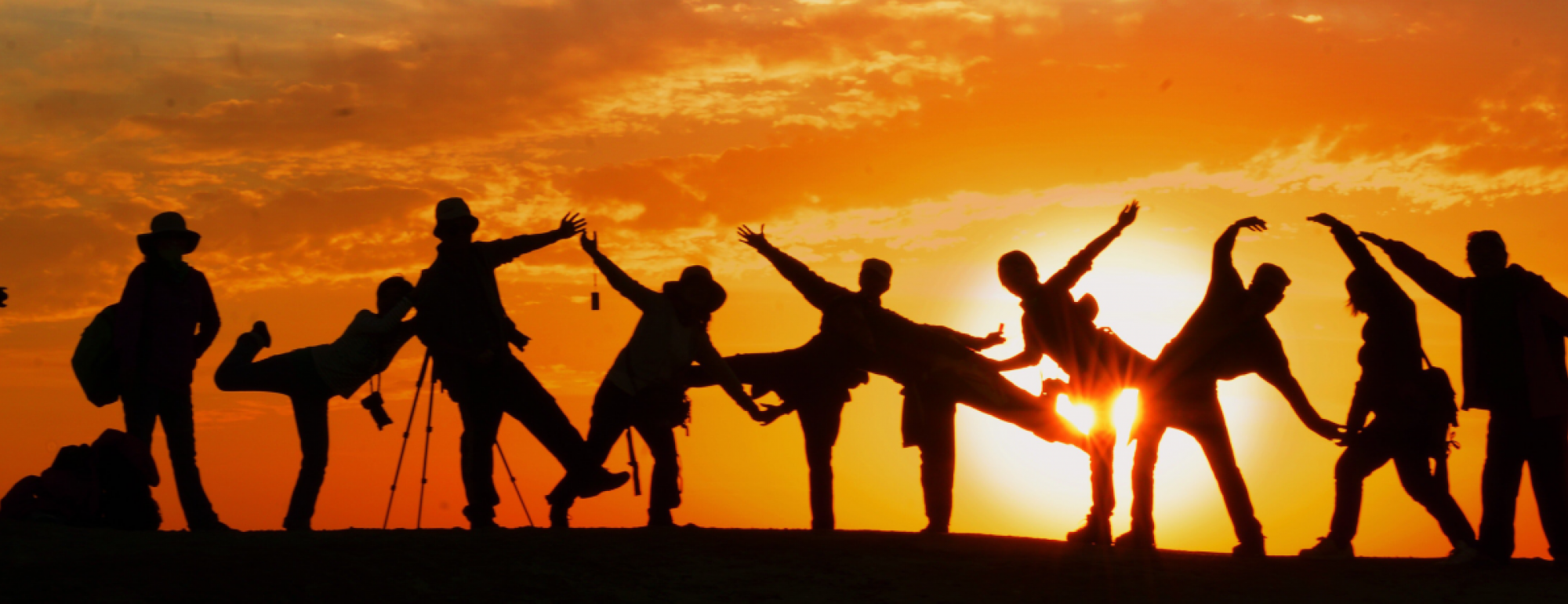 uc davis community development students stand in shadows at sunset