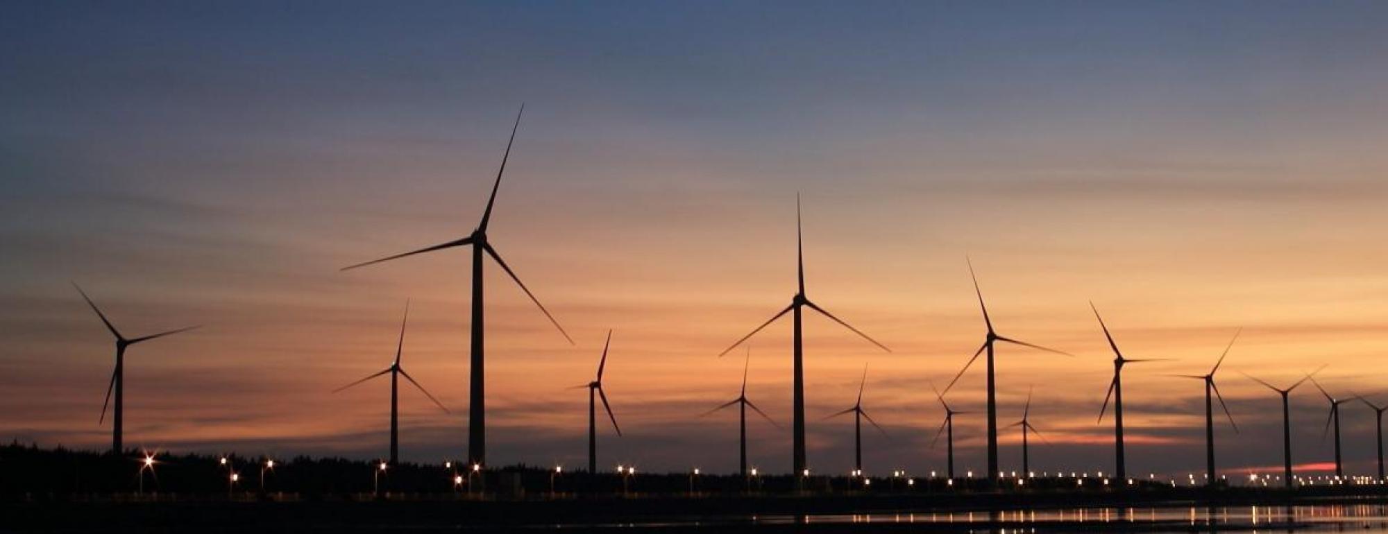 wind turbines at sunset