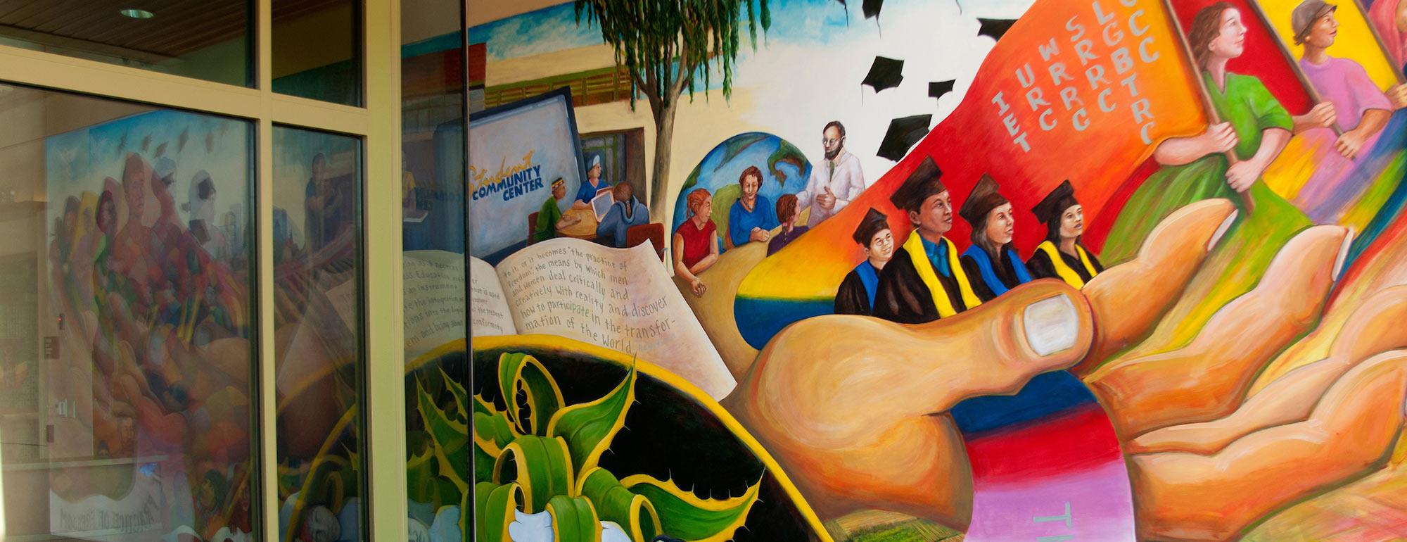 An image of a mural painted on the Student Community Center