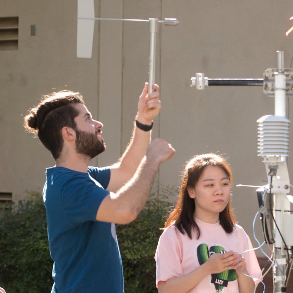 Students working with weather instruments