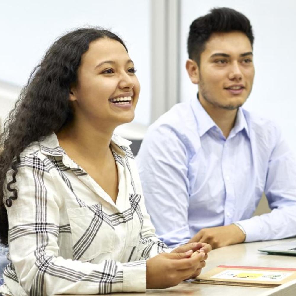 students listening to a presentation in a classroom