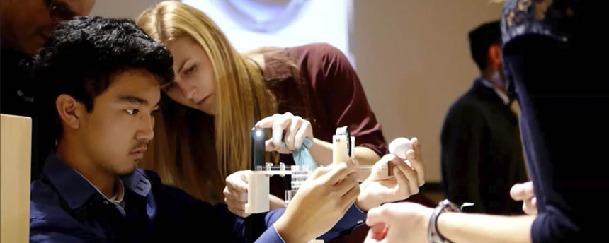 Two students test their device for medical exams