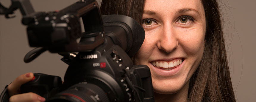 A woman with a video camera