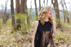 Dar Williams walking in the woods.