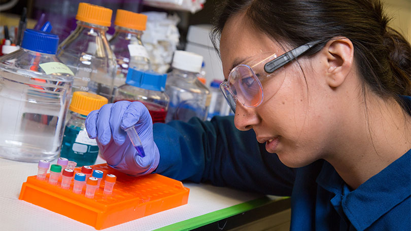 Emily Eijansantos in a lab setting