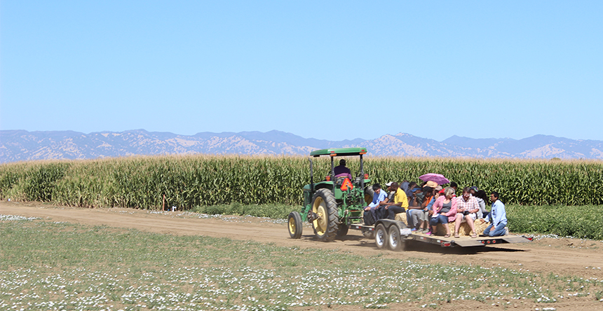 A tractor pulls a wagon at Russell Ranch