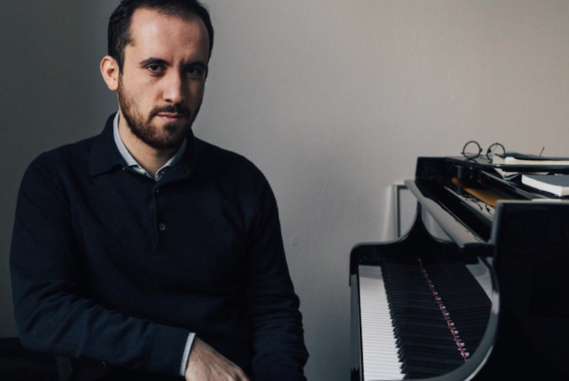 Igor Levit sitting at a piano.