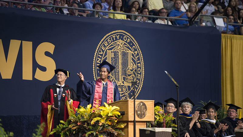 Photo of University Medalist on commencement stage