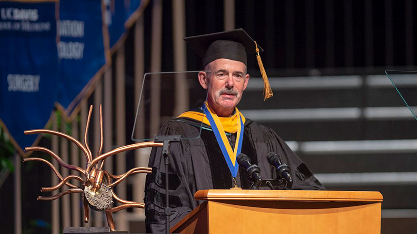 Man at graduation podium