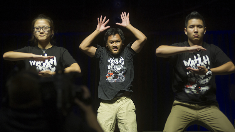 Three members of the Popping Club dancing