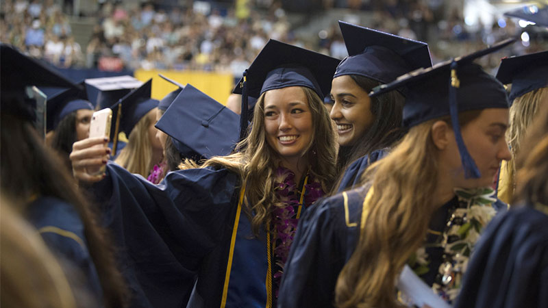 Two female students pause for a selfie