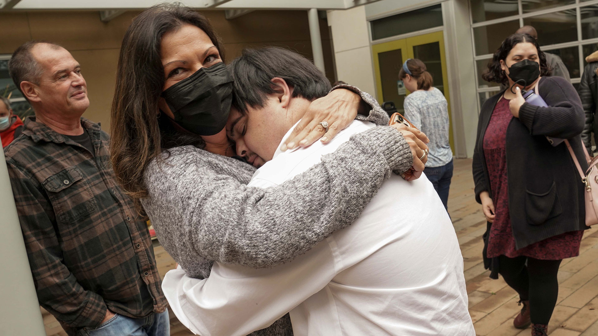 SEED Scholar Ryan Fitch hugs his mom, Melissa, after the student exposition in December