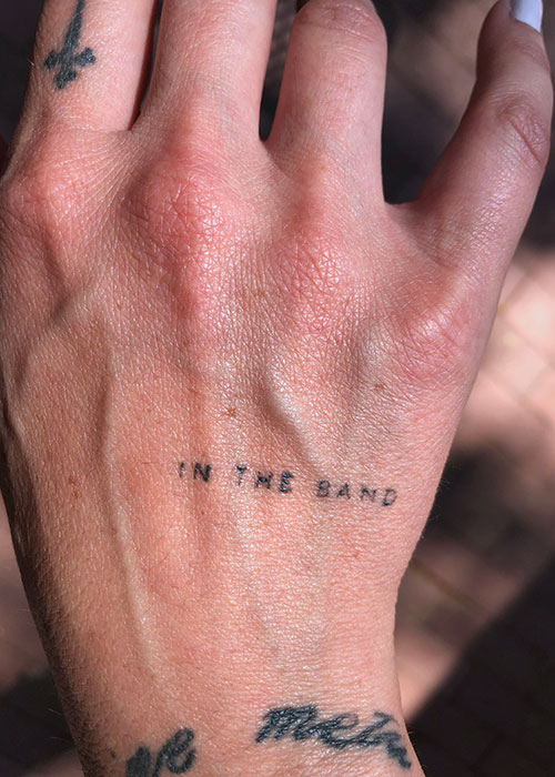 Jordan Fitch's tattoo that reads "in the band"