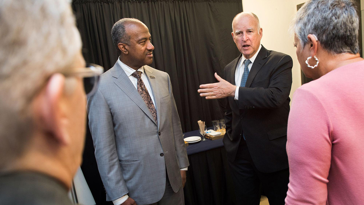 Chancellor Gary S. May with then-Gov. Jerry Brown