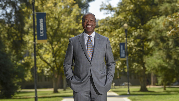 UC Davis Chancellor Gary S. May smiles on the Quad