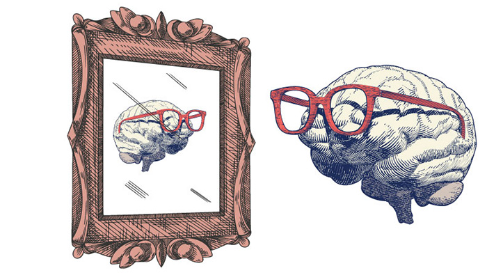 Illustration of a brain with glasses on looking into a mirror