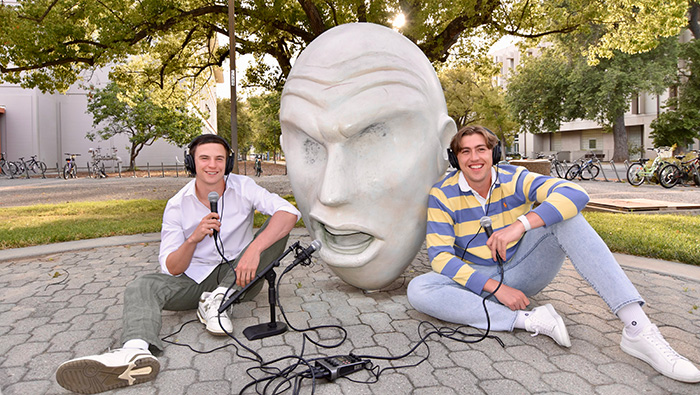 Discovering Academia podcast hosts pictured outside on campus