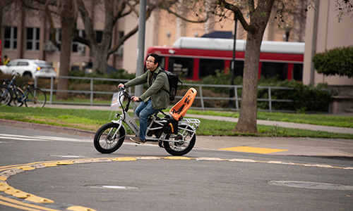 Electric bike rider in a traffic circle