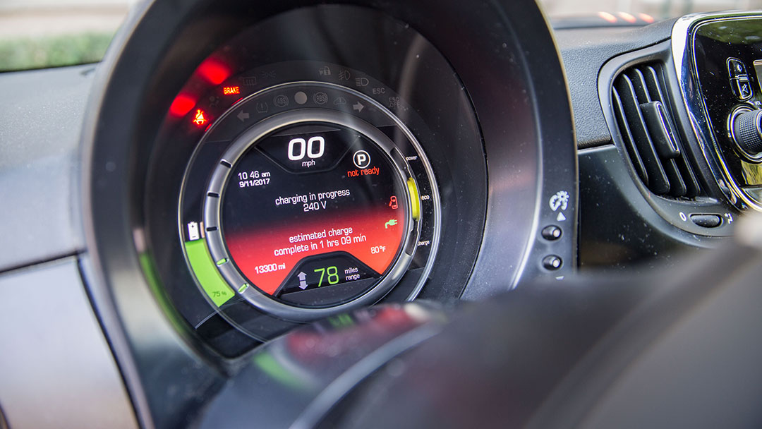 close-up view of an electric vehicle dashboard while it's being charged